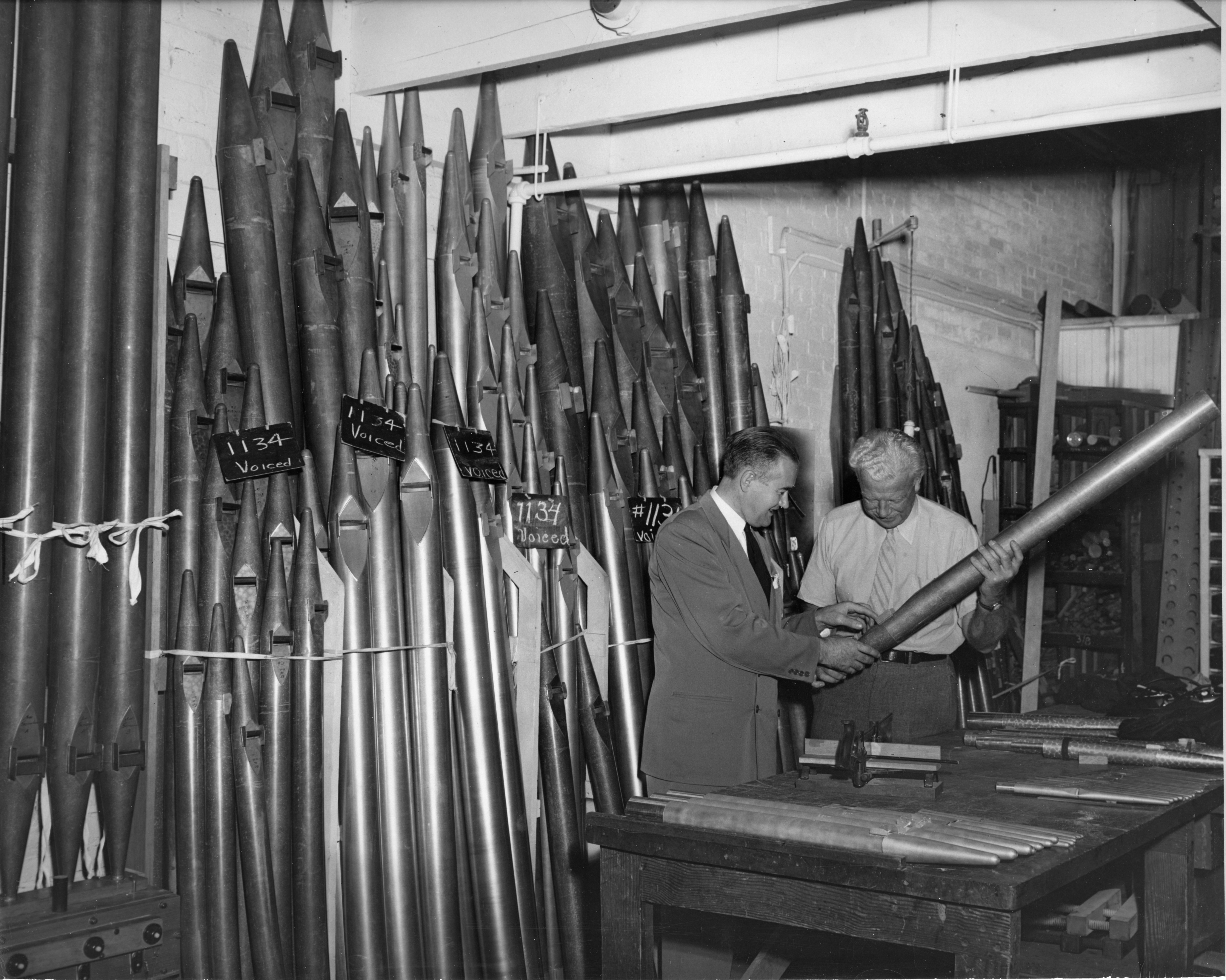 Organist E. Power Biggs and designer G. Donald Harrison viewing the Symphony Hall organ pipes in production at the Aeolian-Skinner plant.