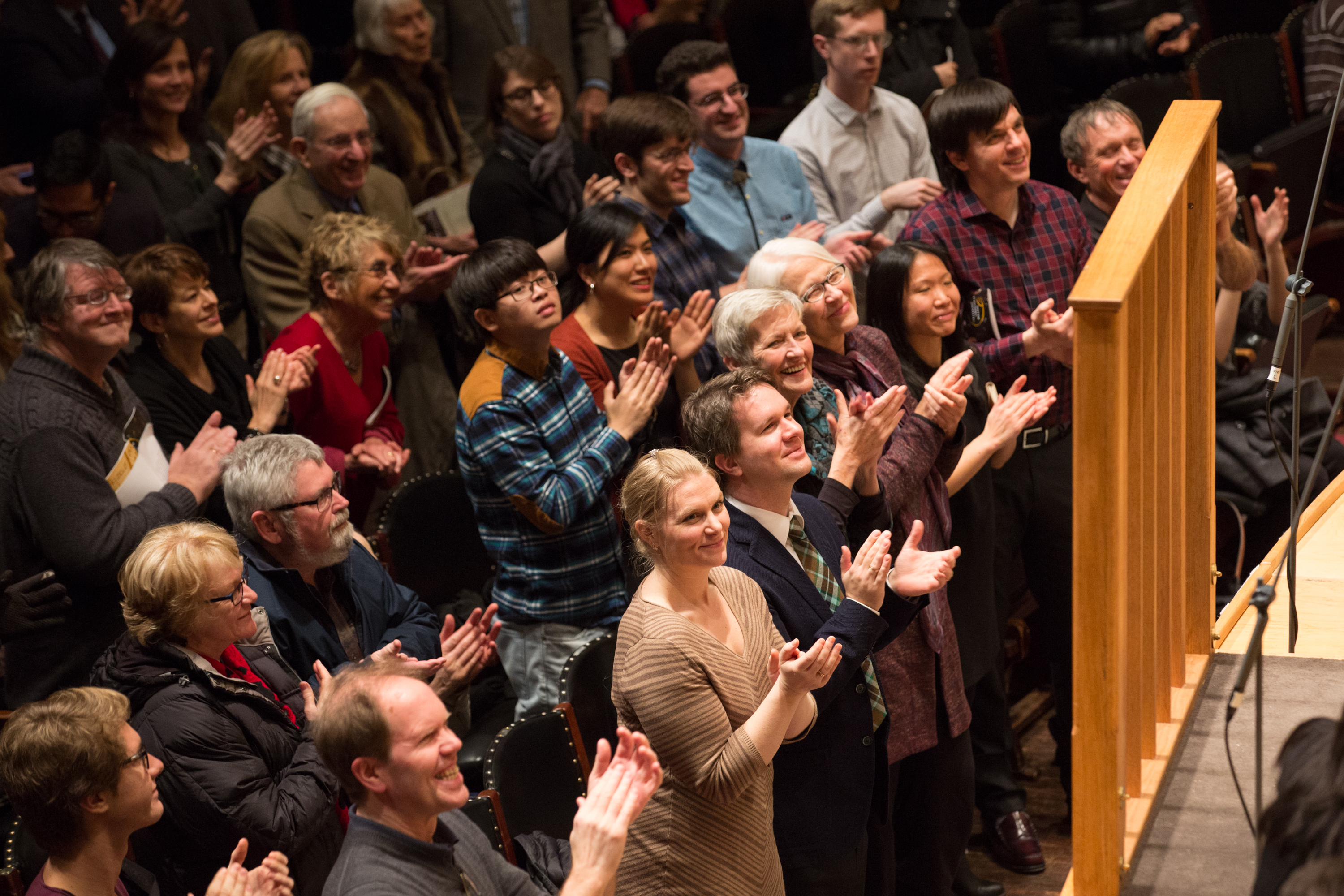 A crowd in Symphony Hall gives a standing ovation