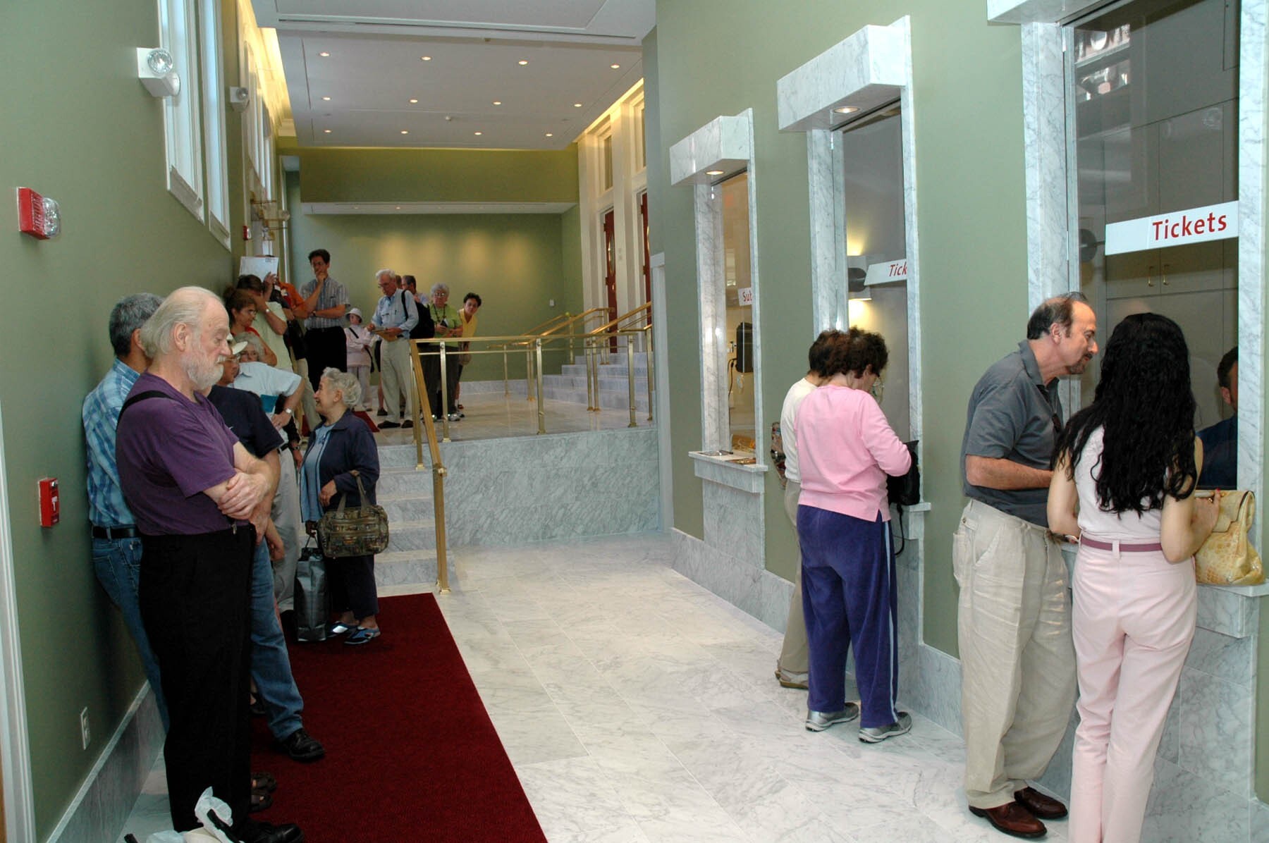 People stand in the lobby by the box office during the ribbon cutting ceremony for the newly renovated Massachusetts Avenue Lobby on September 6, 2005