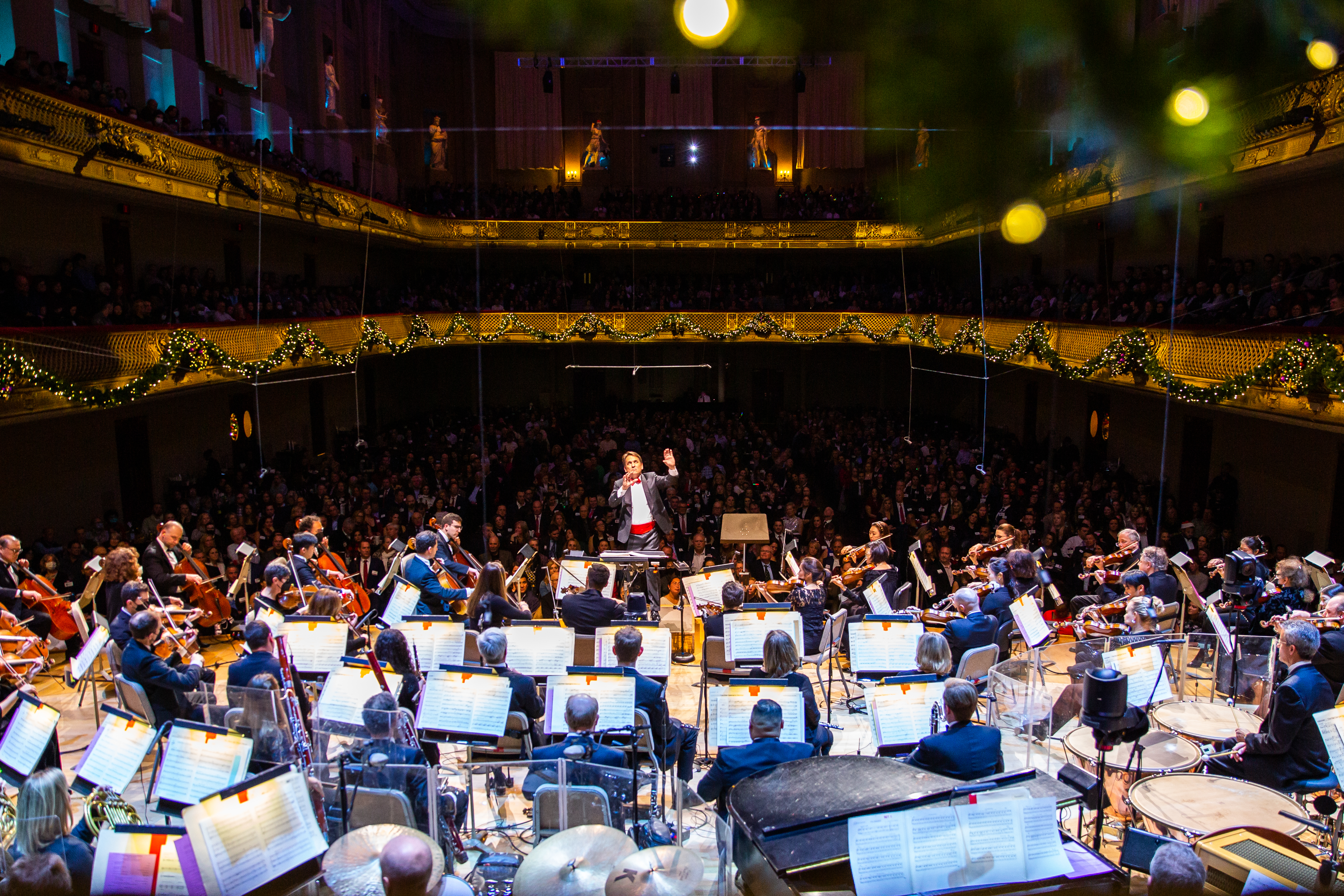 Keith Lockhart standing on the podium conducting the Boston Pops.