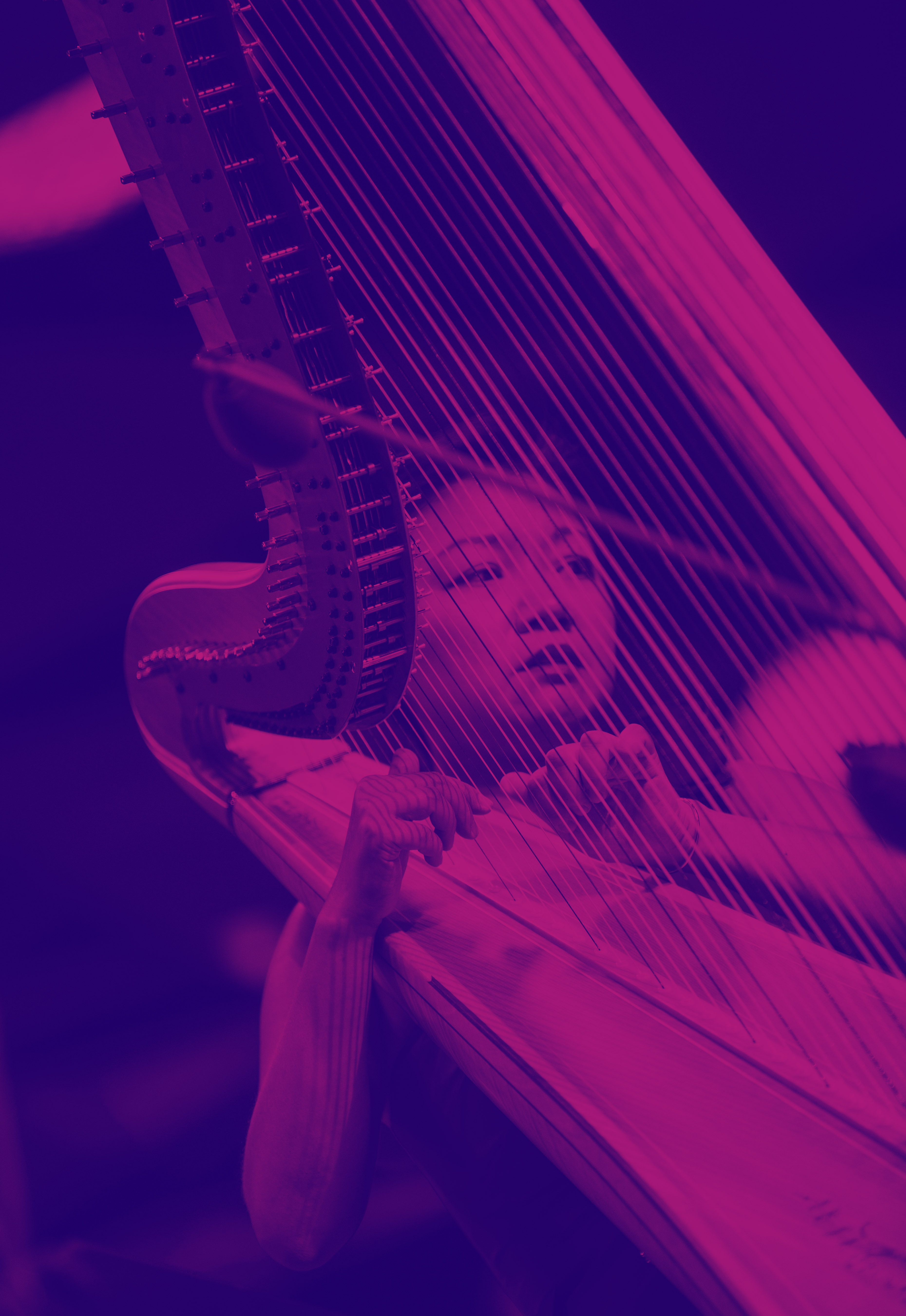 Jessica Zhou playing harp in blue and purple light