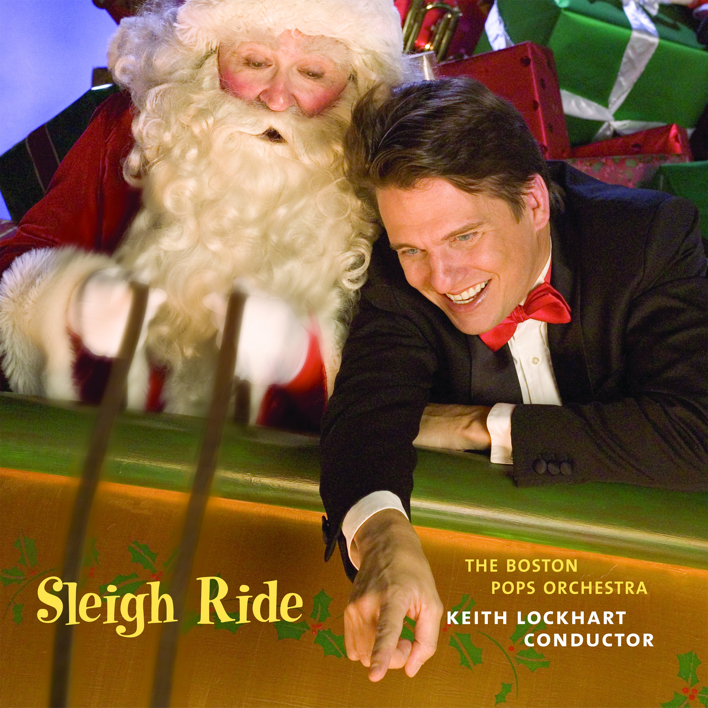 Sleigh Ride album cover depicts Keith Lockhart and Santa Claus sitting in a sleigh with Keith pointing in excitement at something off screen