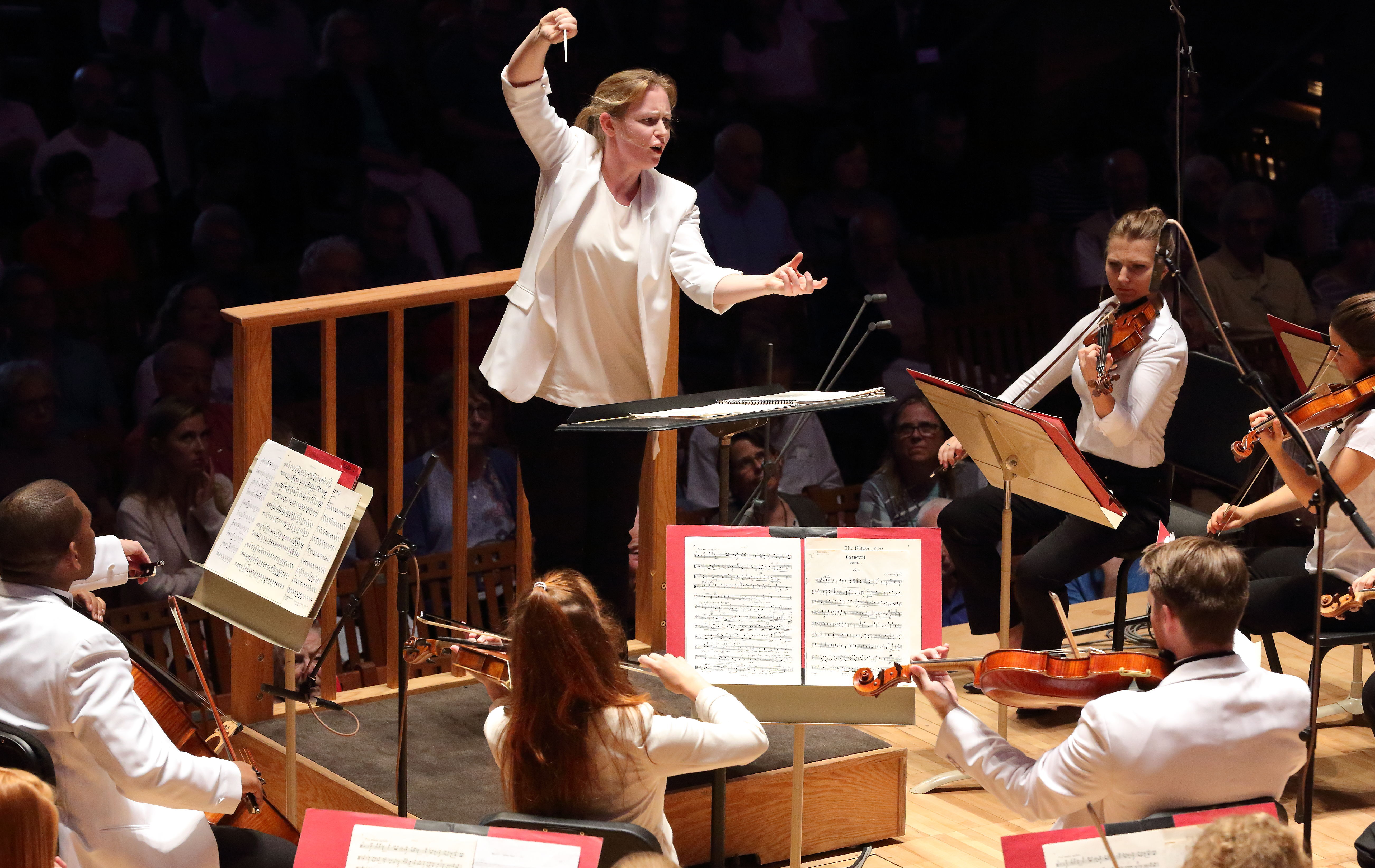 Gemma New conducting the Tanglewood Music Center Orchestra from the podium at Ozawa Hall.