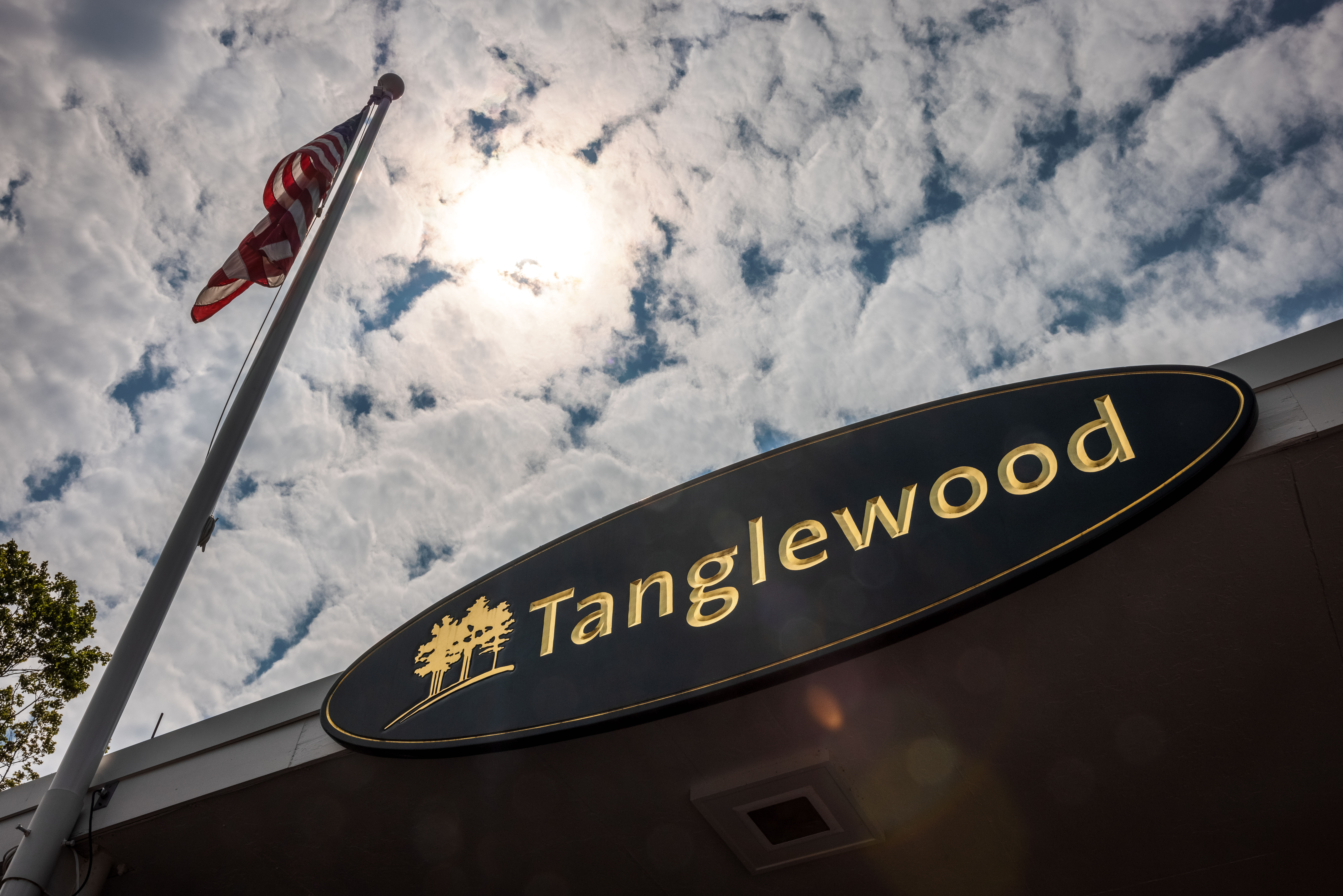 The Main Gate Entrance to Tanglewood on a partially cloudy day