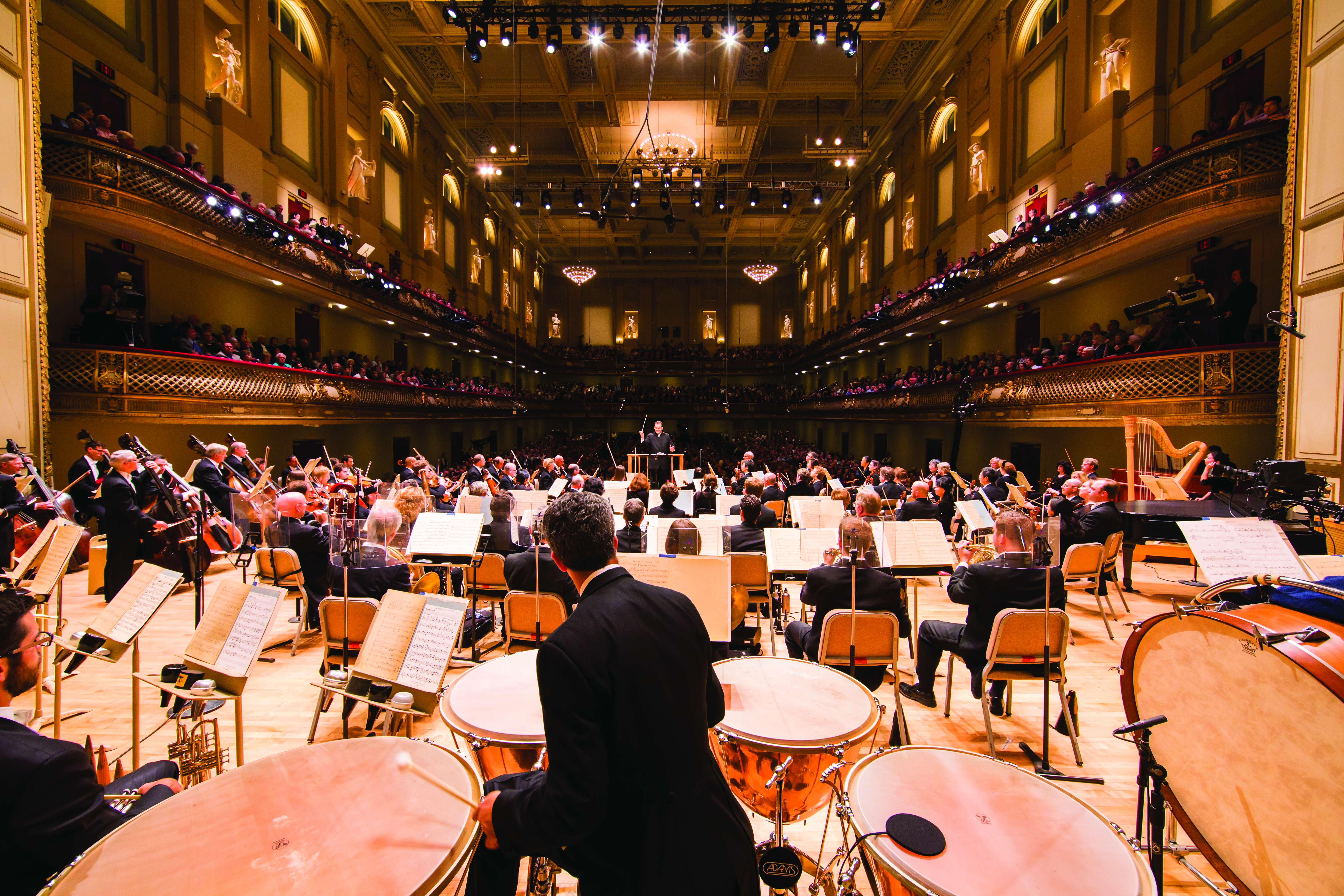 Onstage view of musicians performing at Symphony Hall during a concert.