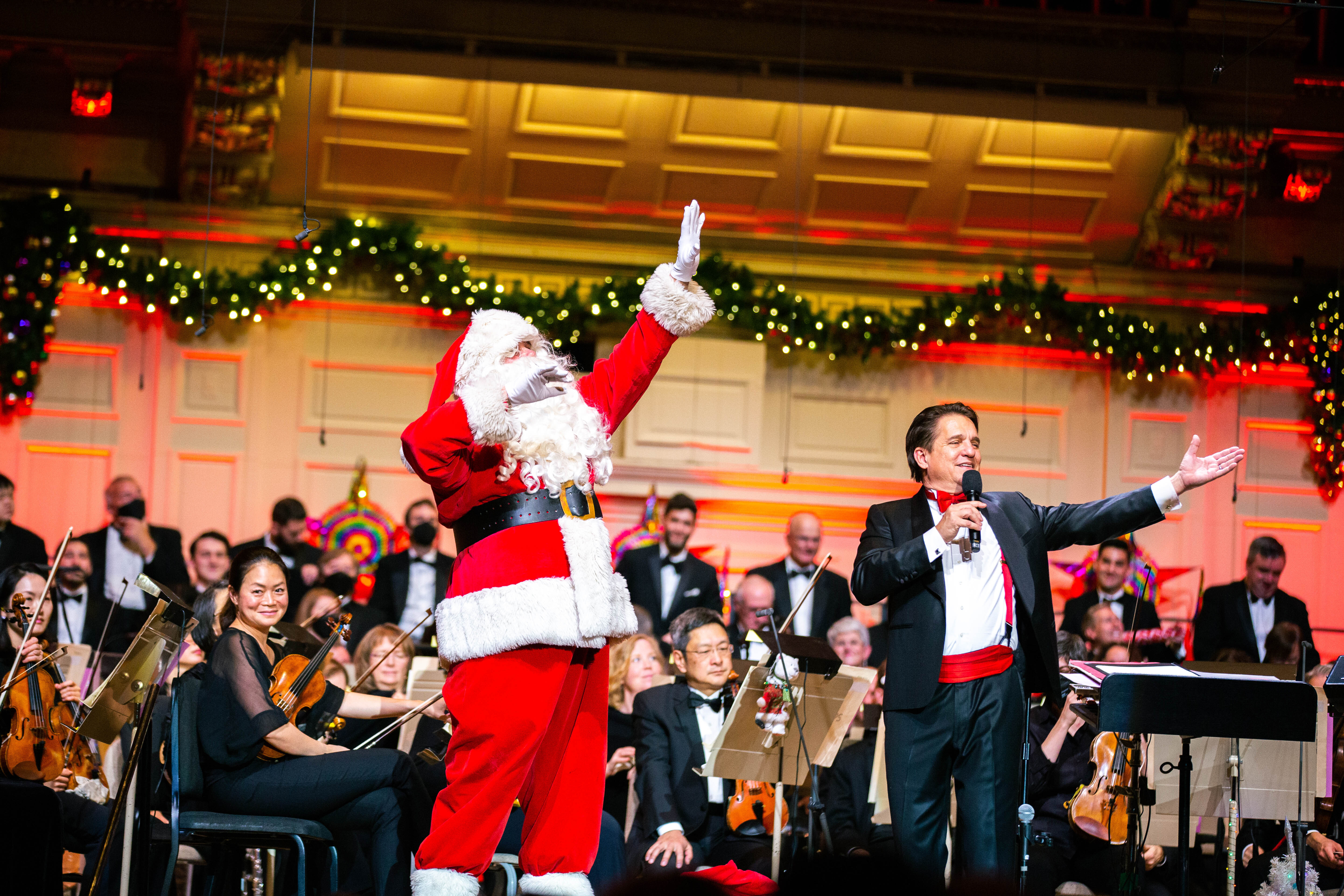 Keith Lockhart and Santa wave to the audience