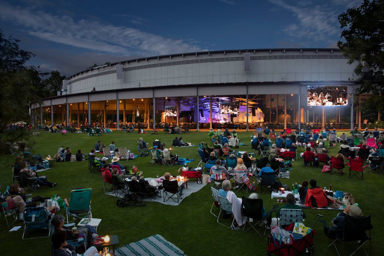 patrons having an evening picnick in front of the Shed at Tanglewood