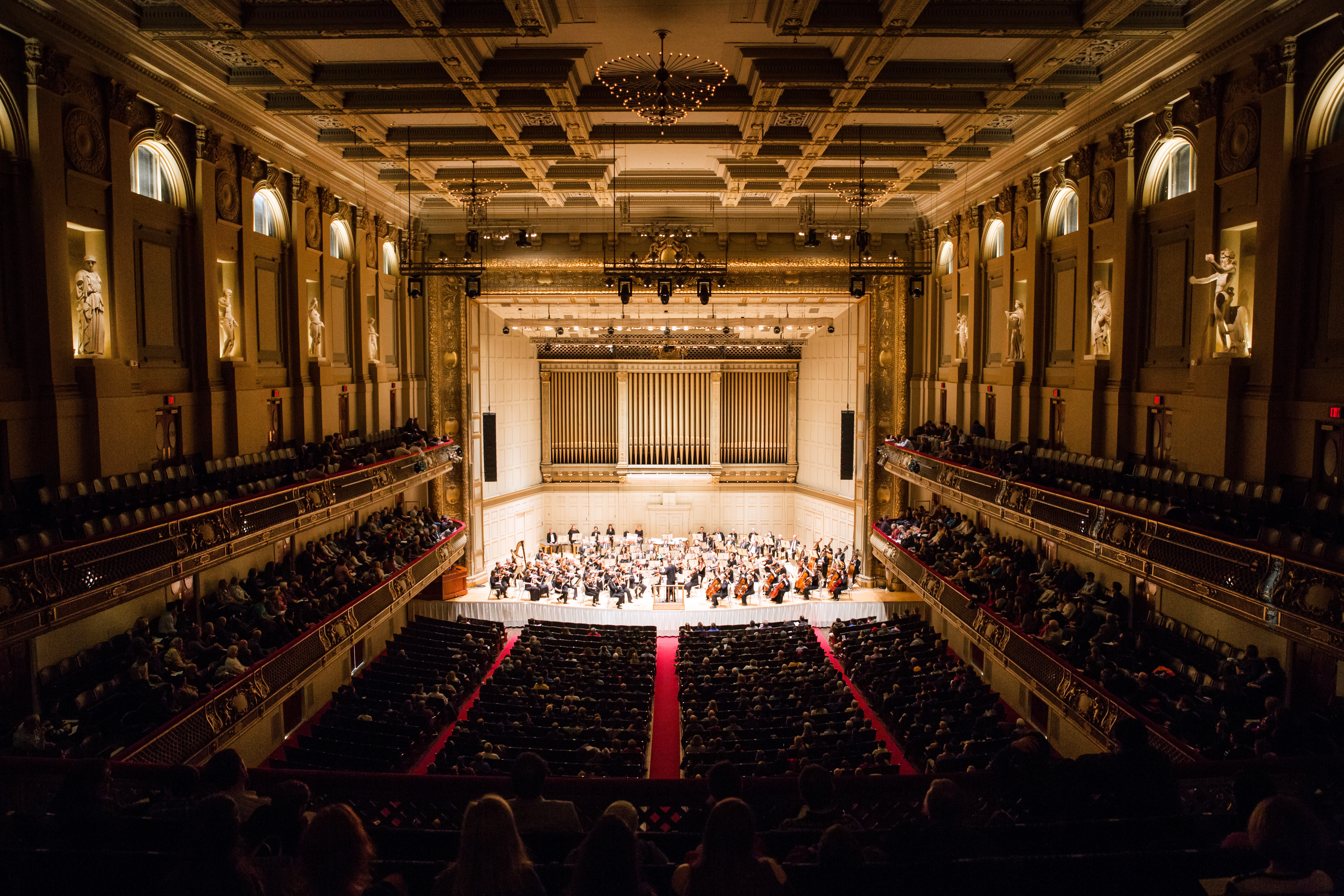 An audience watches a BSO concert at Symphony Hall