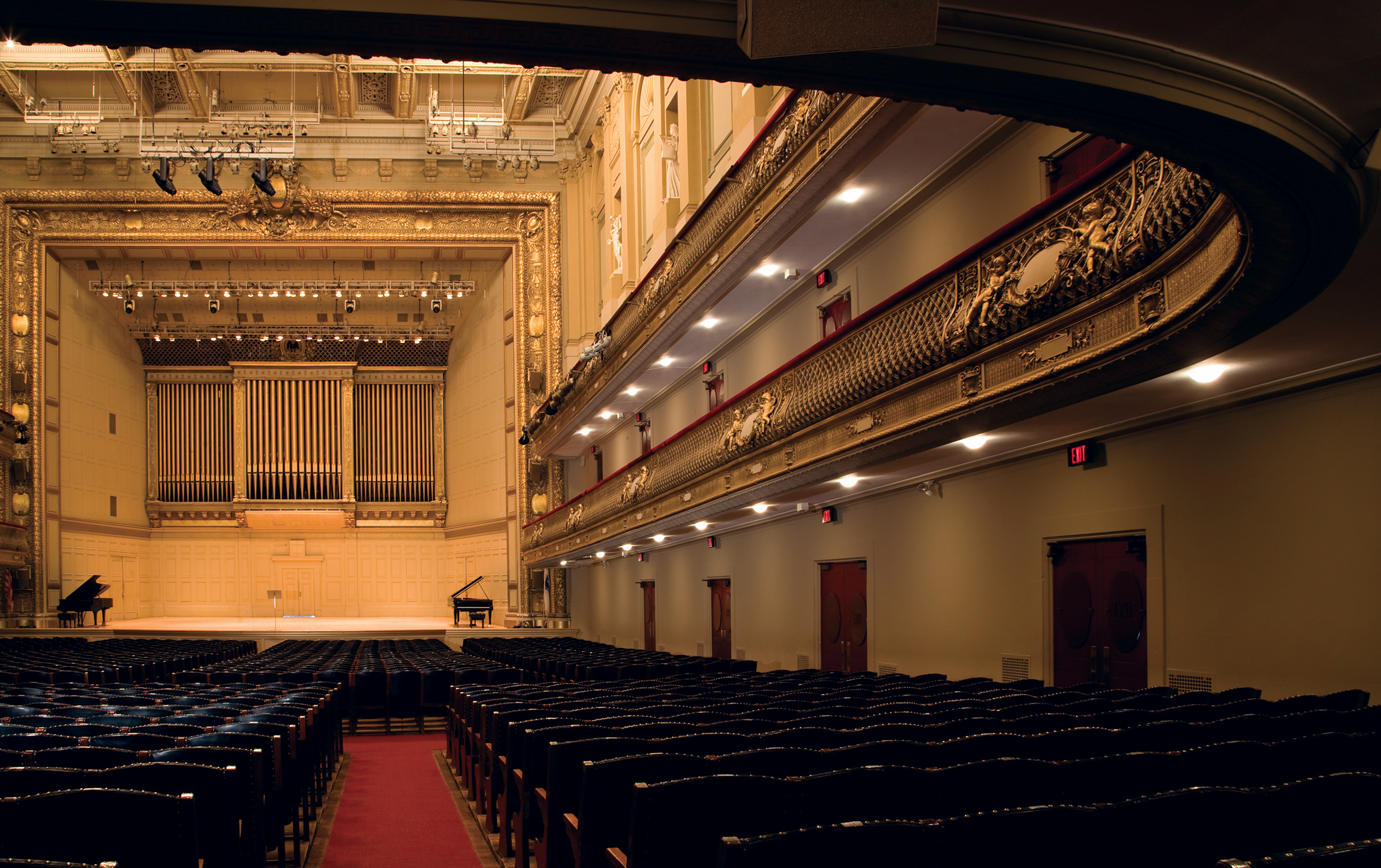A view of the empty Symphony Hall, with the stage in the distance